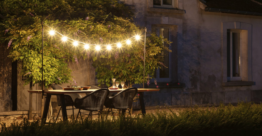 Vincent Sheppard Light My Table in a garden dining space